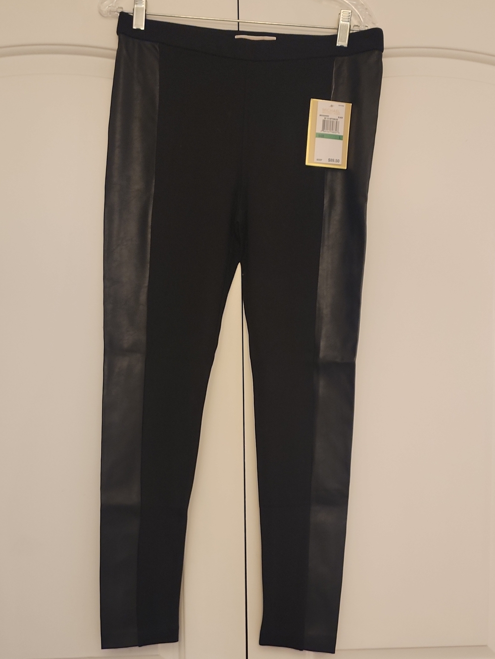 Michael Kors Black Leather Item with Gold-Trim Tag